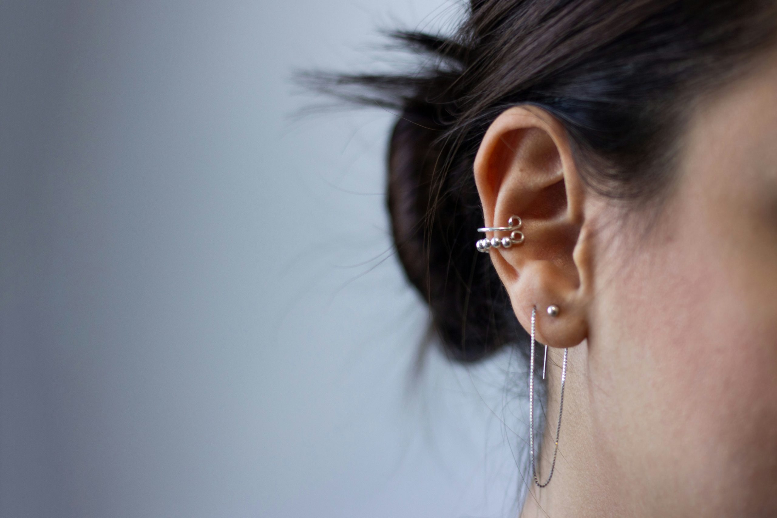 Unsplash Image: CC0 Licence They might&rsquo;ve once been the reserve of gothic teenagers, but piercings are now a mainstream beauty priority. As seen from celebs like Cynthia Erivo and Florence Pugh, a well-styled, well-chosen piercing really can improve your beauty game. But if you&rsquo;ve never had a piercing before, or you&rsquo;re thinking about getting your first piercing in adulthood, then you might not have a clue where to start with finding the chicest option. Teenagers typically lean towards the most outlandish or statement piercings. Yet, as an adult in the working world, you want something that&rsquo;s more casual and that serves as an addition to your outfits, rather than a screaming statement all of the time. But what piercing fits that bill? Frustratingly, the answer varies for everyone. Keep on reading as we delve into a few considerations that could help you find the perfect piercing at last. # 1 - Think About Your Features Features should undeniably be the first thing you think about when considering piercings, as these literally mean the difference between a piercing that works and one that definitely doesn&rsquo;t. Ultimately, you want a piercing that works in harmony with your features, rather than an ill-suited one that stands out in the wrong way at every turn. Face shape is perhaps the main consideration here, especially when you&rsquo;re thinking about facial piercings like a nose ring, septum, or lip piercing. In this instance, people with an oval face can typically look fantastic with statement earrings or a sleek nose stud, while a round face can work best with teardrop studs, helix piercings, or a nose ring. There are plenty of face shape tools you can use if you&rsquo;re unsure which category you fall into. Then, you&rsquo;ll be able to do a little research into your most flattering options. Bear in mind that other features should also play a role here. For instance, you may sometimes find that cartilage piercings are both unflattering and sometimes not even possible on certain ears. Equally, you&rsquo;ll want to think about nose shape, with everything from the depth of your dips to the width of your nose itself making a difference. Let&rsquo;s say you have a wide nose with subtle dips; you may well want to shop for gold nose rings here to finish your look. Alternatively, if you have a narrow nose with deep dips, striking studs may well work better. Pexels Image: CC0 Licence # 2 - Consider What Works With Your Style Let&rsquo;s not forget that even the technically best piercing for your features will still look out of place if you don&rsquo;t also factor general style into your choice. As we&rsquo;ve already touched on, you no longer need to be a teenager all dressed in black to look great with a piercing, but you will want to tread carefully with style matches in mind. After all, if you tend to lean into sleek professional outfits complete with shirt, skirt, and blazer, a septum or helix piercing is unlikely to feel like a good fit. That&rsquo;s not to say you can&rsquo;t still go down this route, but beware that you&rsquo;ll possibly make more of a statement than you intend by doing so. Instead, people who love this look might prefer to opt for more subtle piercing additions, like small earring studs or rings, and a nose stud at most. But how about if you prefer a slightly alternative style? Perhaps you&rsquo;re all into dungarees, Docs, and flowing dresses. In this case, you&rsquo;ll undeniably complete your look better by scrapping those subtle piercings in place of more outlandish choices, like earring stacks, nose rings, septums, or even a lip stud. Simply take a step back, think about the items in your wardrobe, and then get realistic about which piercings would actually work the best alongside them. # 3 - Lifestyle Must be a Factor If you forget to factor your lifestyle into this decision, then even the technically best piercing for your features and style won&rsquo;t be enough to save your looks. So, it&rsquo;s also well worth thinking about your general lifestyle and situation before you jump on the piercing bandwagon. It&rsquo;s especially important to factor in your job here, as you want to be sure that you can actually wear that piercing daily. Luckily, employers are becoming way more accepting of piercings nowadays, but there are still situations where statement piercings simply won&rsquo;t work. For instance, if you work in a hospitality environment, you might be limited on the piercings you can get for safety reasons. Alternatively, if you work a job in a very traditional office setting, anything aside from small earring studs is probably a bad idea. Alternatively, there are many environments where piercings can become a key part of your work look. For instance, many fashion retailers love individual looks across their staff members. Equally, modern offices and co-working spaces are all about colourful self-expression, meaning that even a snakebite lip ring could fit well. Pexels Image: CC0 Licence # 4 - If In Doubt, Try it Out If you&rsquo;ve gone through this list and still aren&rsquo;t sure about piercing specifics, why not just try a few things out to see if you like them? There are now plenty of fake or magnetic piercing products out there, and wearing these for a week or so will help you to judge everything from appearances to general lifestyle practicality. Admittedly, you&rsquo;ll want to steer clear of really cheap fake piercing jewellery, as this can look bad even if the piercing idea is technically good. So, always seek high-quality options that give you an accurate representation of how a piercing would look. This is sure to help you find confidence in your choices, and will also help you adjust to those looks before they become permanent fixtures that you can&rsquo;t change even if you wanted to. Conclusion Piercings can be a real game-changer for your overall style, and they can be the thing to set you apart in the most striking ways possible. Simply make sure you choose the right piercing for you using these top tips. 